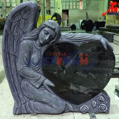 Black granite heart shaped and hand carved angel gravestone