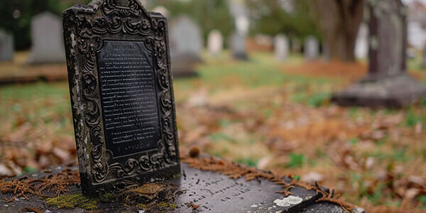 a_plaque_placed_on_a_tombstone