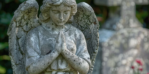 a_granite_angel_statue_cemetery a_granite_angel_statue_cemetery