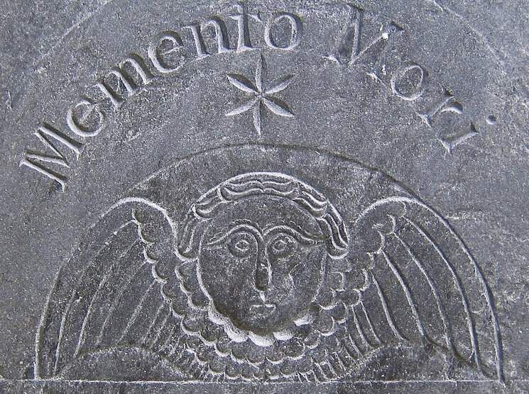 What does a skull with wings mean on a grave2
