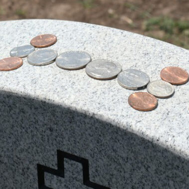 penny on a gravestone