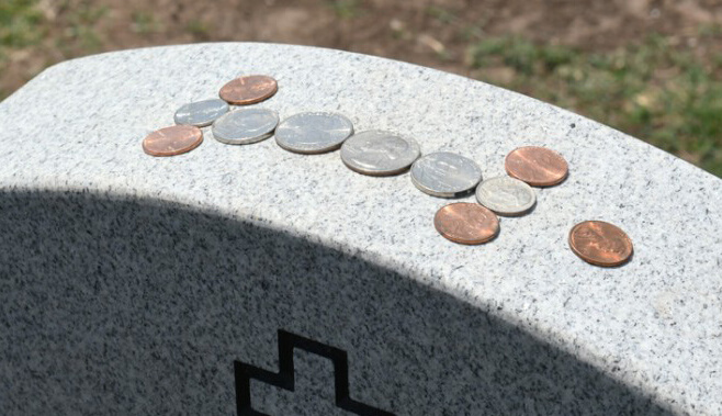 penny on a gravestone