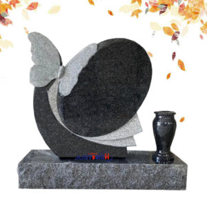 Custom granite tombstone with butterfly carving