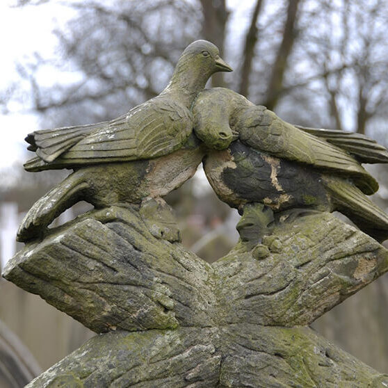 carved birds on headstone carved birds on headstone