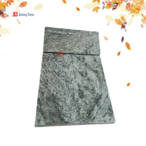 Green granite tilted tombstone